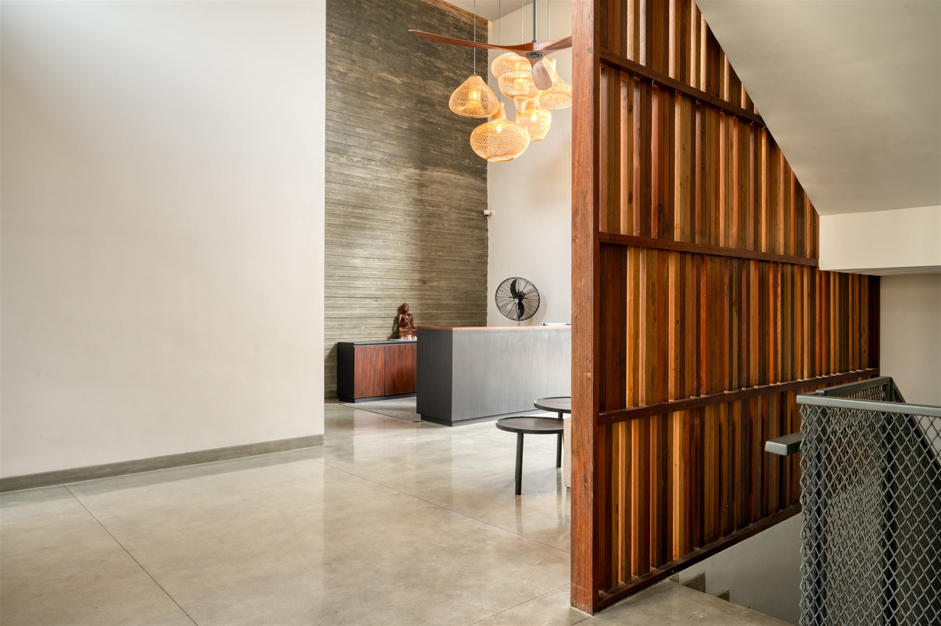 Reception with pendant lights and timber screen