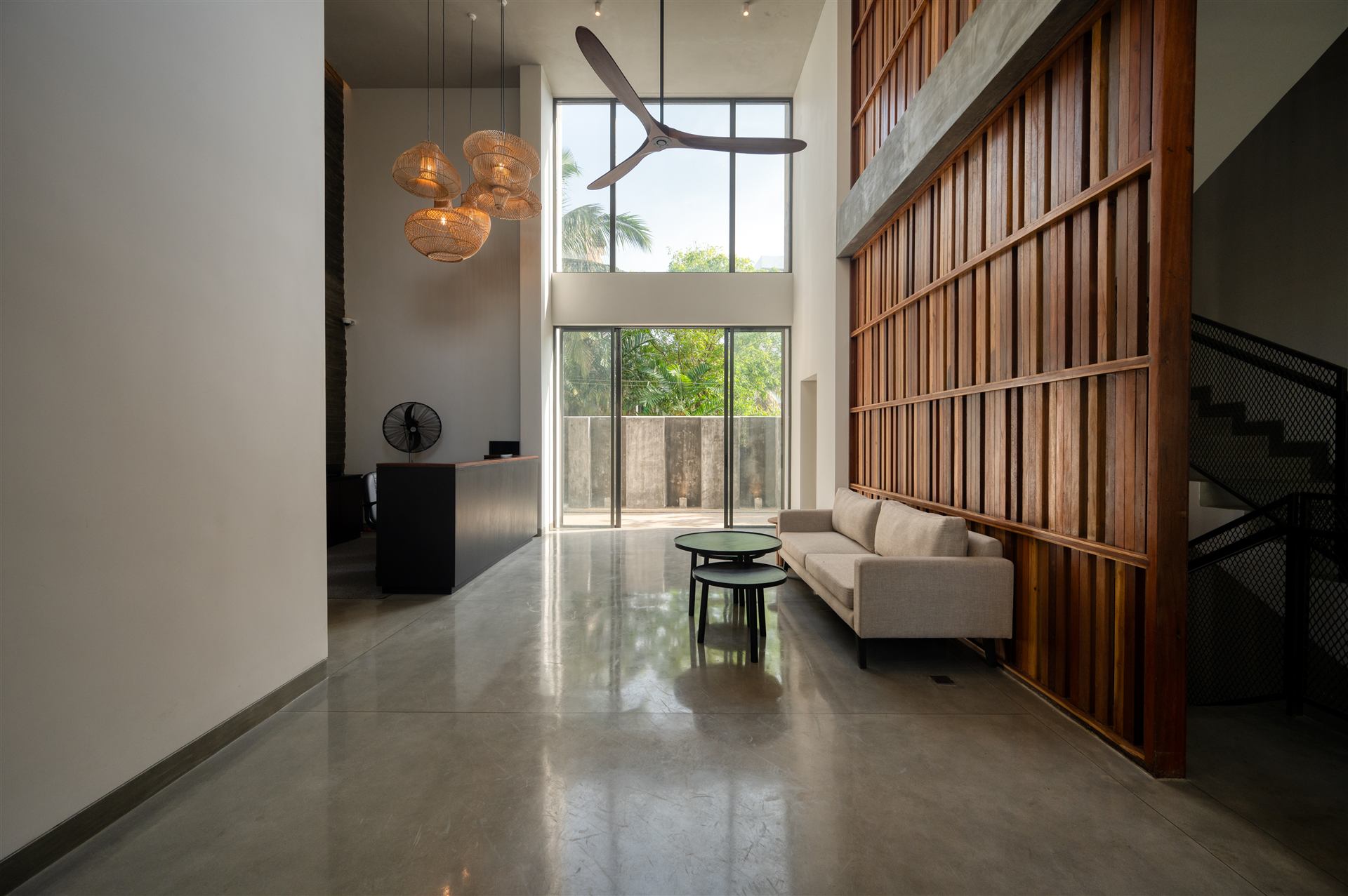 Lobby lounge with timber screen and rattan pendants