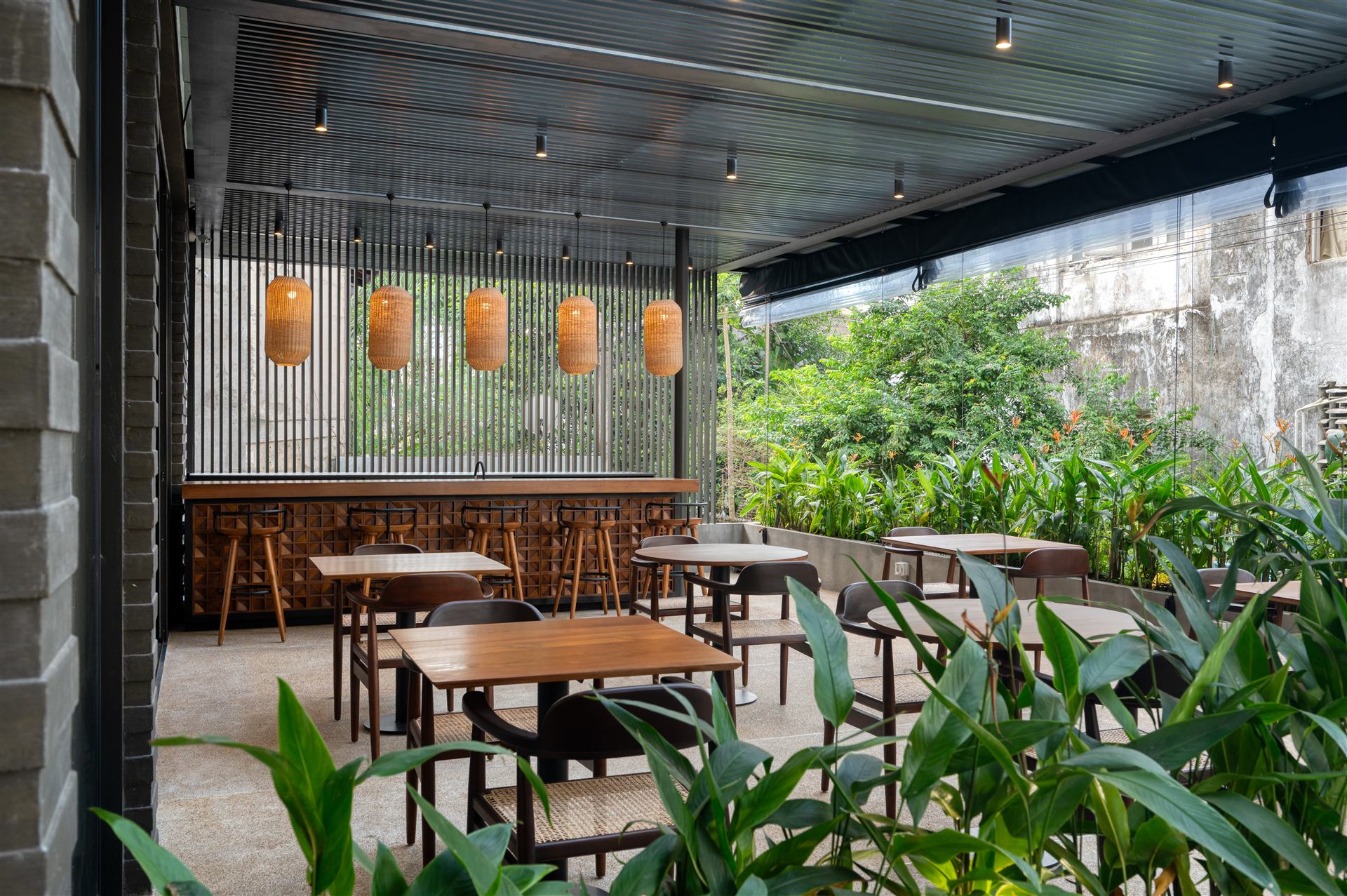 Restaurant terrace framed by tropical planting