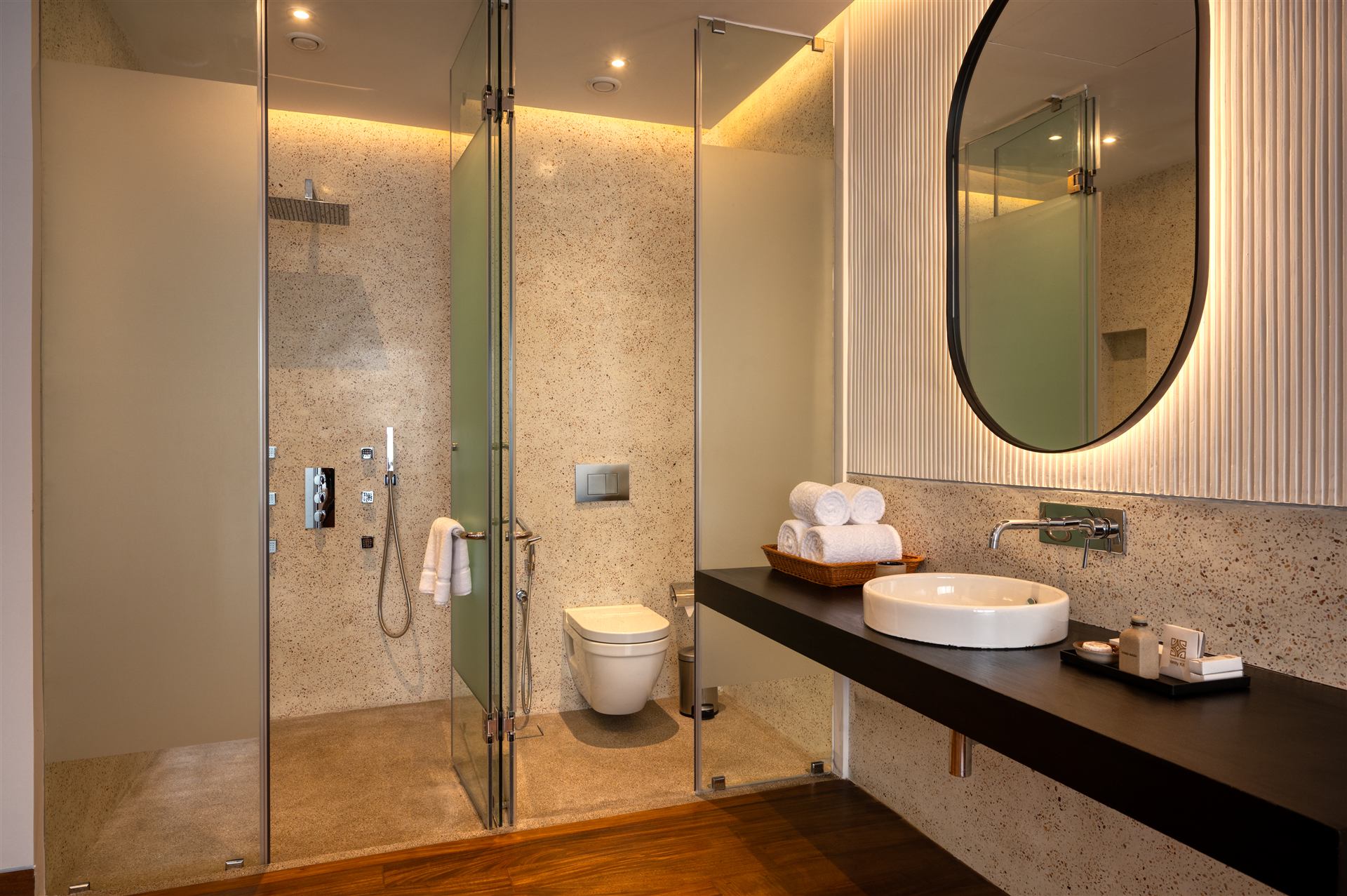 En-suite bathroom with terrazzo walls and walk-in shower